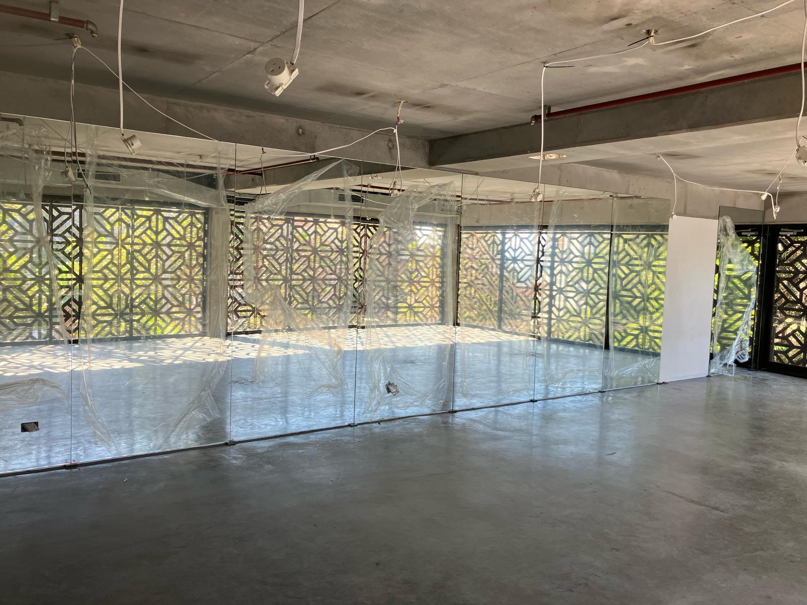 Commercial mirror wall Sydney with full height frameless mirror panels