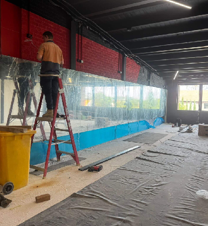 Mirror wall in school gym Sydney showing full fitness training space
