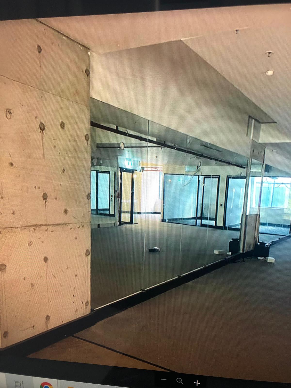 Gym mirror wall Sydney with large frameless mirrors for fitness training