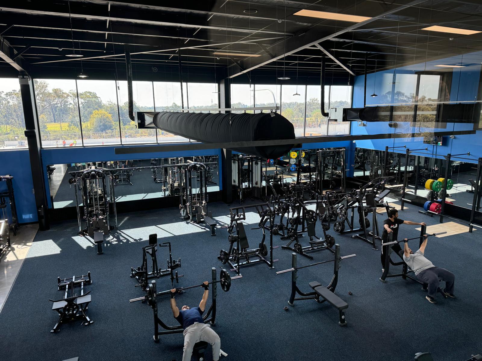 gym mirror wall Sydney with equipment installed according to AS1288 Australian Standards
